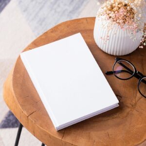 Gap Year Movement coaching program promo image placeholder with book mockup in warm, cozy setting